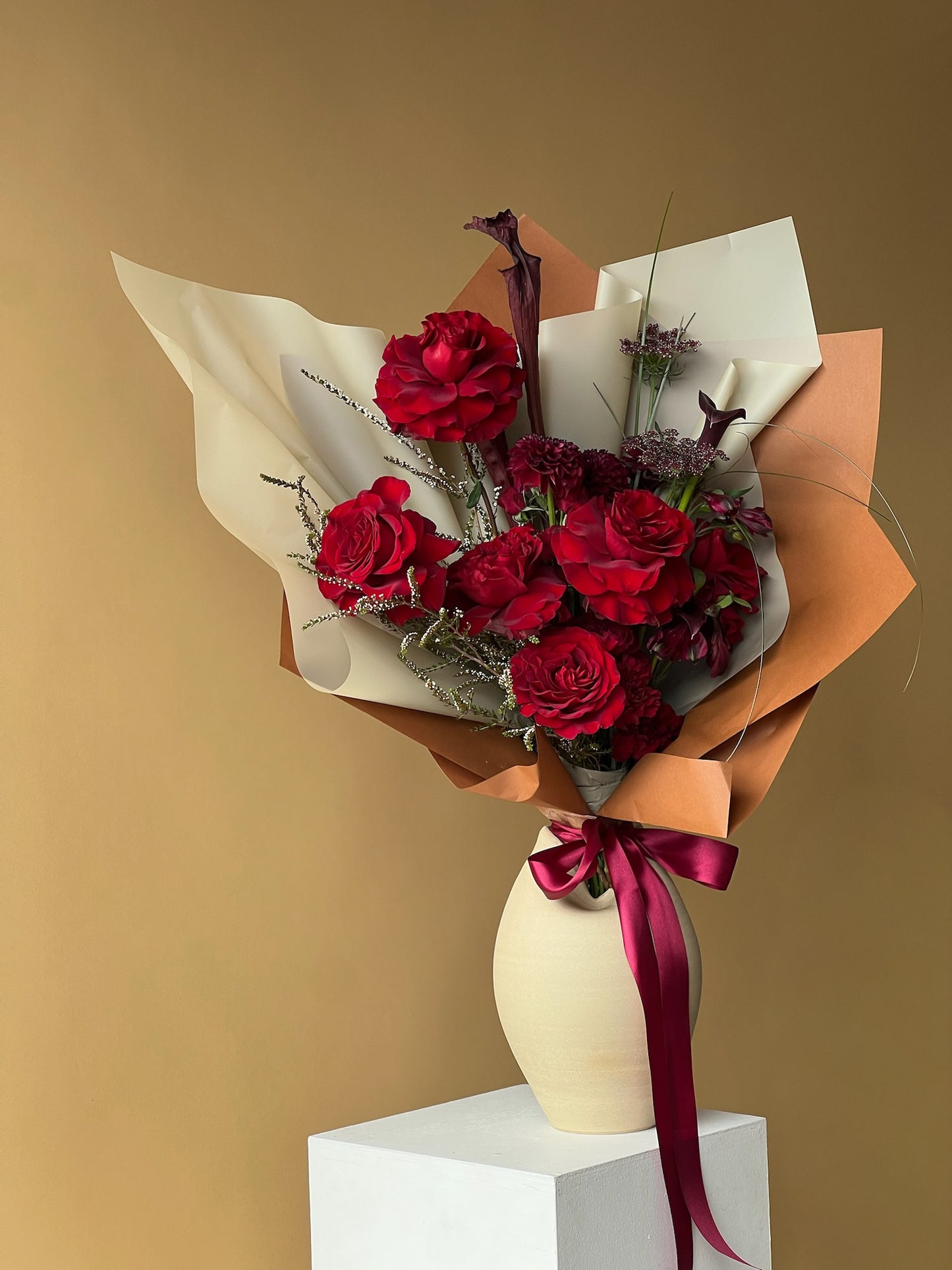 Vancouver Florist - Bouquet of flowers in a vase, passionate reds