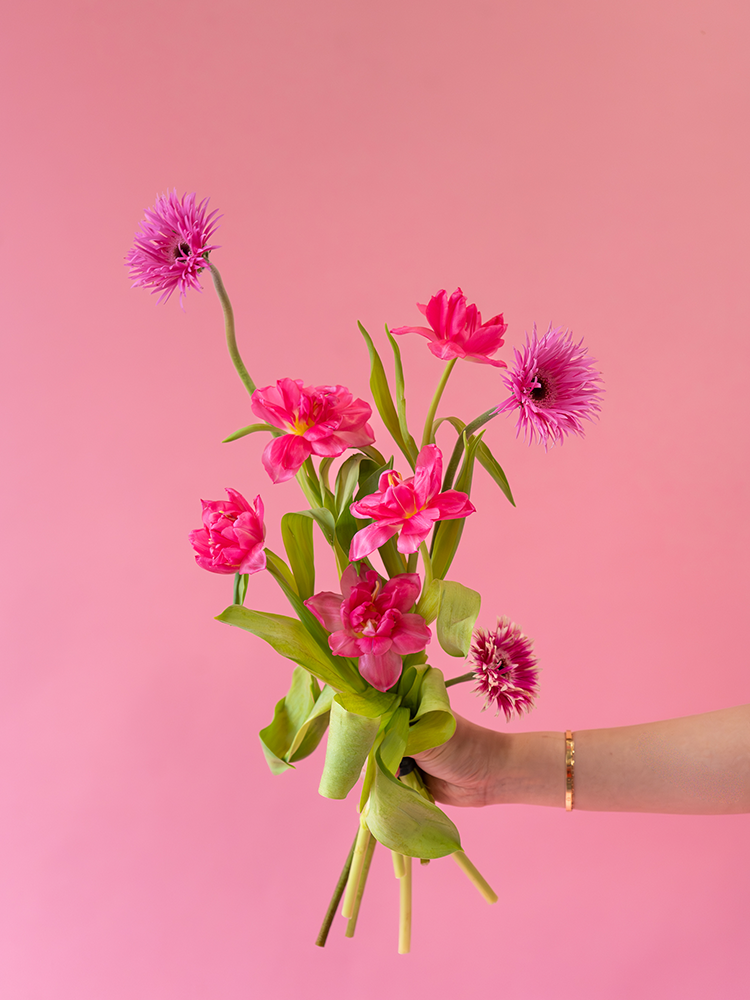 Vancouver Flower Delivery - Valentine's Bouquet of pink flowers held against a pink background